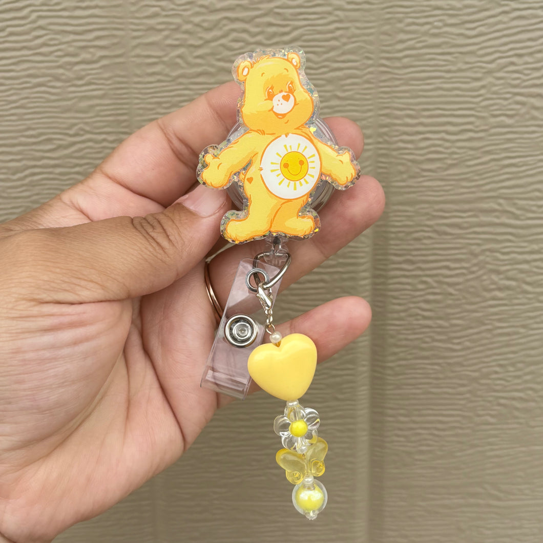 Yellow CareBear Badge Reel